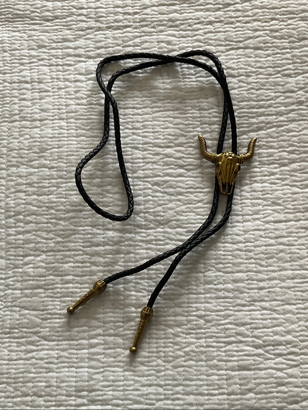 Gold-colored steer/bull skull bolo tie